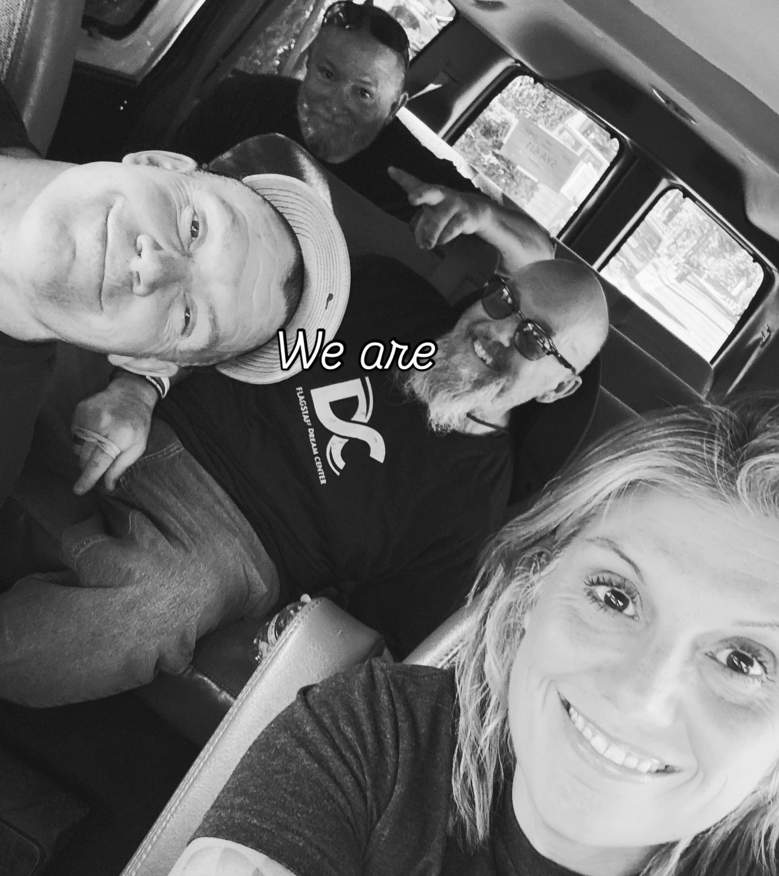 Flagstaff Dream Center team in a van. The photo already includes the words We are.